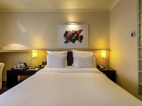 Habitación Superior con vistas a la ciudad - 1 cama grande del hotel Pullman Sao Paulo Ibirapuera. Foto 1