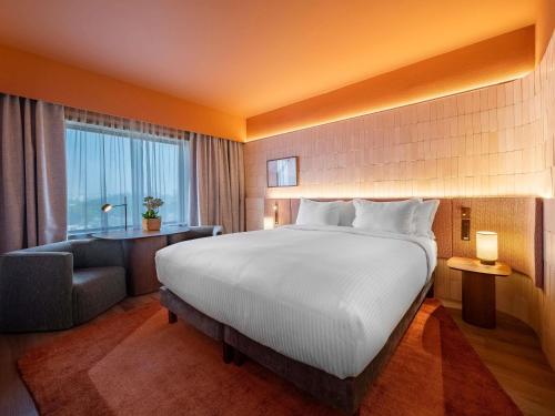 Habitación Executive Premium con vistas a la ciudad del hotel Pullman Sao Paulo Ibirapuera. Foto 3