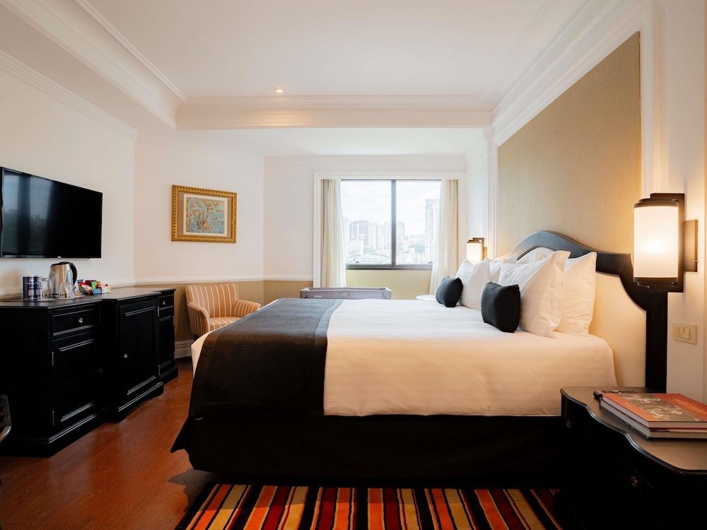 Habitación familiar con cama doble y una cama individual para un niño del hotel Grand Mercure Sao Paulo Ibirapuera