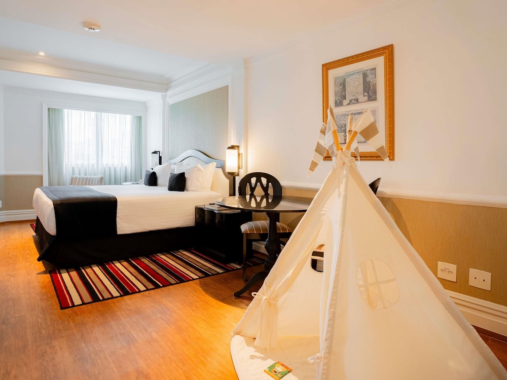 Habitación familiar con cama doble y una cama individual para un niño del hotel Grand Mercure Sao Paulo Ibirapuera. Foto 7