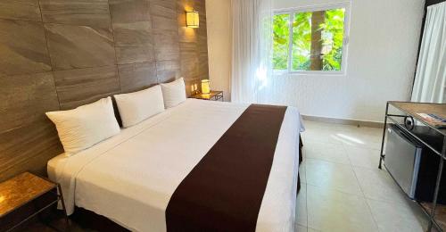 Habitación Deluxe del hotel Tukan Hotel Playa del Carmen. Foto 2