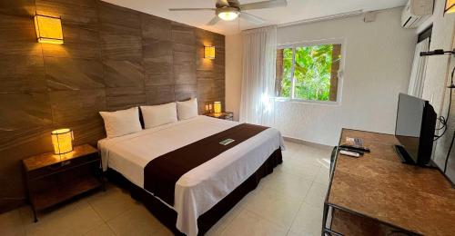 Habitación Deluxe del hotel Tukan Hotel Playa del Carmen. Foto 4