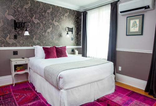 Habitación adaptada para personas con movilidad reducida - Cama grande del hotel Argos Inn. Foto 2