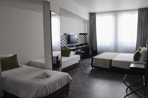 Habitación Cuádruple Executive del hotel Floris Arlequin Grand Place. Foto 2