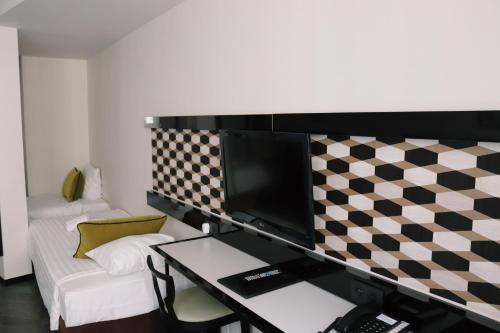 Habitación Cuádruple Executive del hotel Floris Arlequin Grand Place. Foto 3