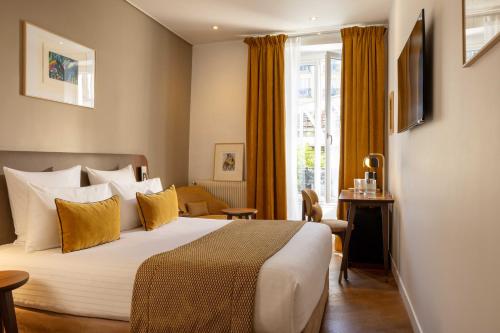 Habitación Doble Confort del hotel Europe Hotel Paris Tour Eiffel. Foto 7