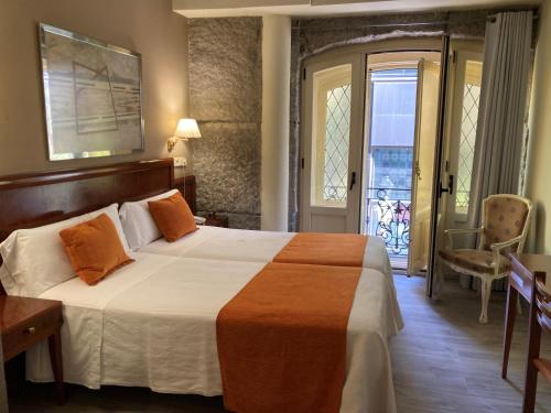 Habitación Doble con vistas a la ciudad - 1 o 2 camas del hotel San Lorenzo. Foto 4