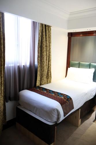 Habitación individual 1 Cama Individual del hotel Dreamtel London Kensington. Foto 12