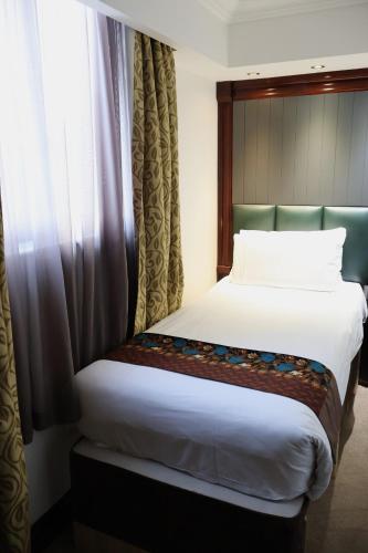 Habitación individual Superior 1 Cama Individual del hotel Dreamtel London Kensington. Foto 8
