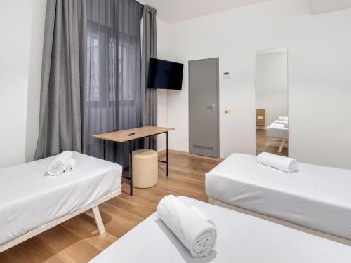 Habitación Triple económica del hotel B&B Milano Ornato. Foto 2