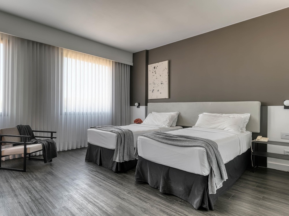 Habitación Premium con 2 camas individuales del hotel Caesar Business Belo Horizonte Belvedere. Foto 1
