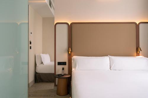 Habitación Triple del hotel Petit Palace Alcala. Foto 5