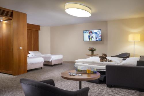 Habitación Familiar Confort del hotel Maritim Stuttgart. Foto 4