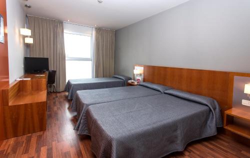 Habitación Triple Estándar del hotel Ag Express Elche. Foto 4
