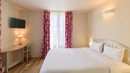 Habitación Doble del hotel Campanile Val de France. Foto 4