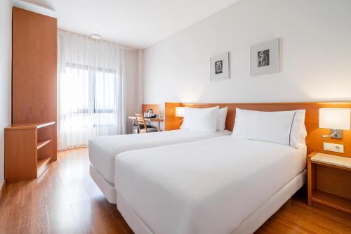Habitación Doble Deluxe con cama supletoria del hotel Exe Pozuelo