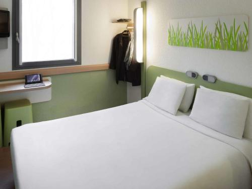 Habitación Doble del hotel Ibis Budget Brussels South Ruisbroek. Foto 1