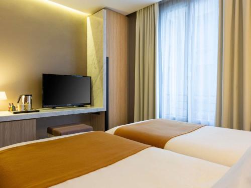 Habitación Twin Estándar - 2 camas del hotel Mercure Paris Alesia. Foto 2