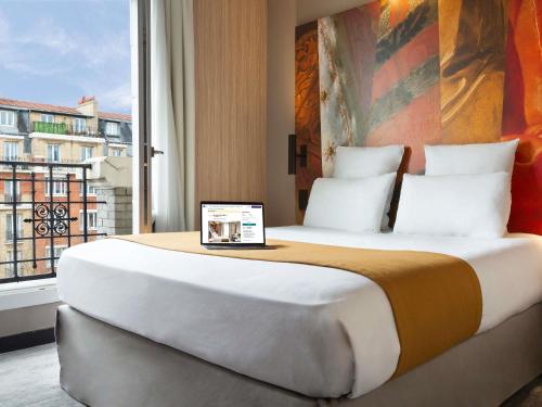Habitación Doble Superior con Balcón del hotel Mercure Paris Alesia. Foto 3