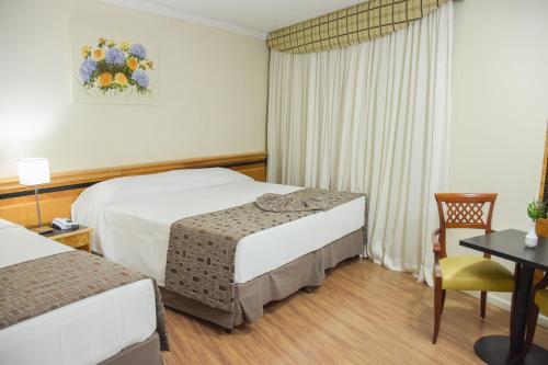 Habitación triple Vista ciudad 1 Cama Individual 1 Cama doble del hotel Golden Park Internacional Foz and Convenções