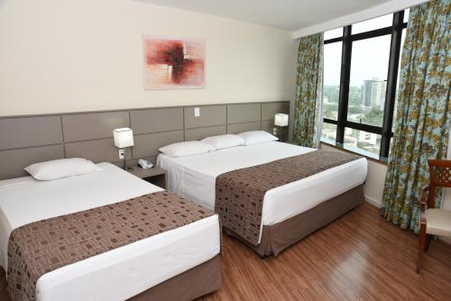 Habitación Triple Deluxe del hotel Golden Park Internacional Foz and Convenções