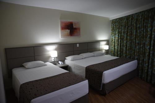 Habitación Triple Deluxe del hotel Golden Park Internacional Foz and Convenções. Foto 1