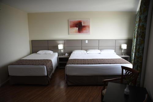 Habitación Triple Deluxe del hotel Golden Park Internacional Foz and Convenções. Foto 4