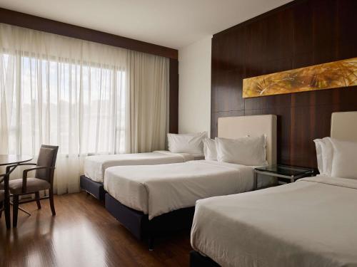 Habitación Clásica - 3 camas individuales del hotel Mercure Belo Horizonte Lourdes. Foto 1