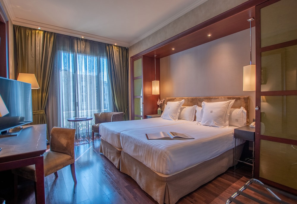 Habitación Doble con cama supletoria del hotel Barcelona Center. Foto 3