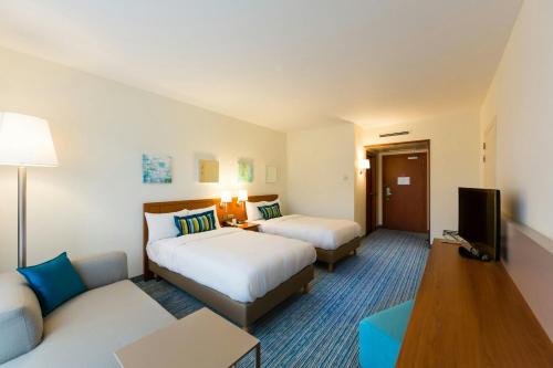 Habitación Doble Deluxe con 2 camas individuales del hotel Courtyard By Marriott Brussels. Foto 4