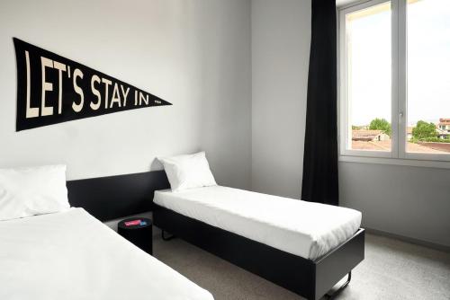 Habitación Doble Deluxe - 2 camas del hotel The Social Hub Florence Lavagnini. Foto 3