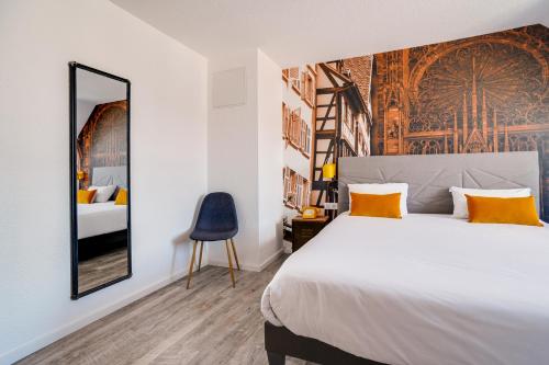 Habitación Cuádruple con 1 cama doble y 2 camas individuales del hotel La Maison Mulhouse Centre. Foto 7