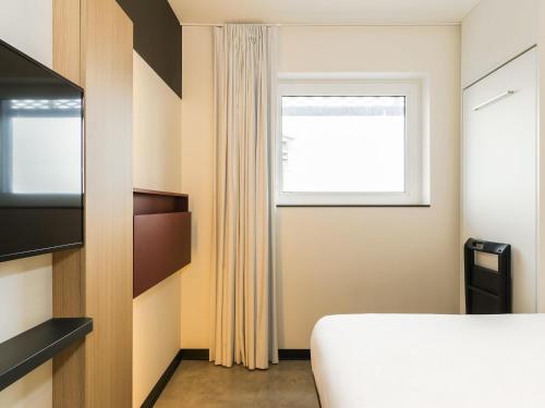 Habitación Triple del hotel Ibis Budget Blankenberge. Foto 1