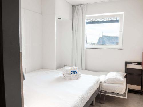 Habitación Triple del hotel Ibis Budget Blankenberge. Foto 9