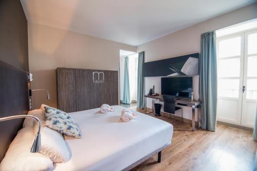 Habitación cuádruple del hotel Petit Palace Santa Cruz. Foto 3