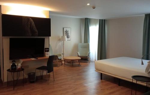 Habitación Cuádruple Superior del hotel Petit Palace Santa Cruz. Foto 2