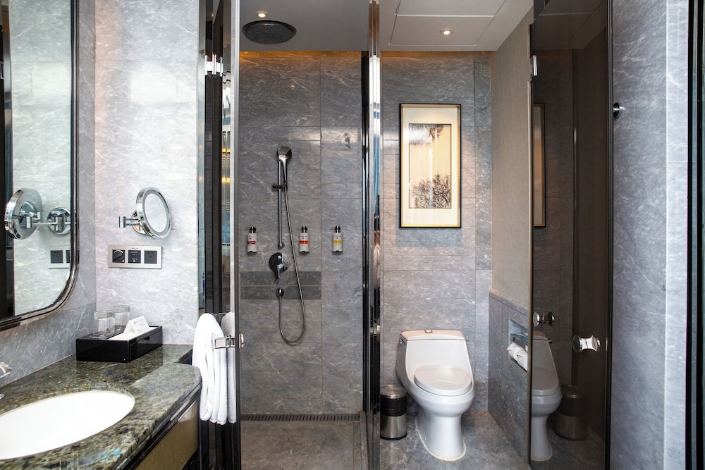 HABITACIÓN DELUXE, Una Cama King, Piso Alto y Vistas a la Ciudad del hotel Pullman Yantai Center. Foto 6