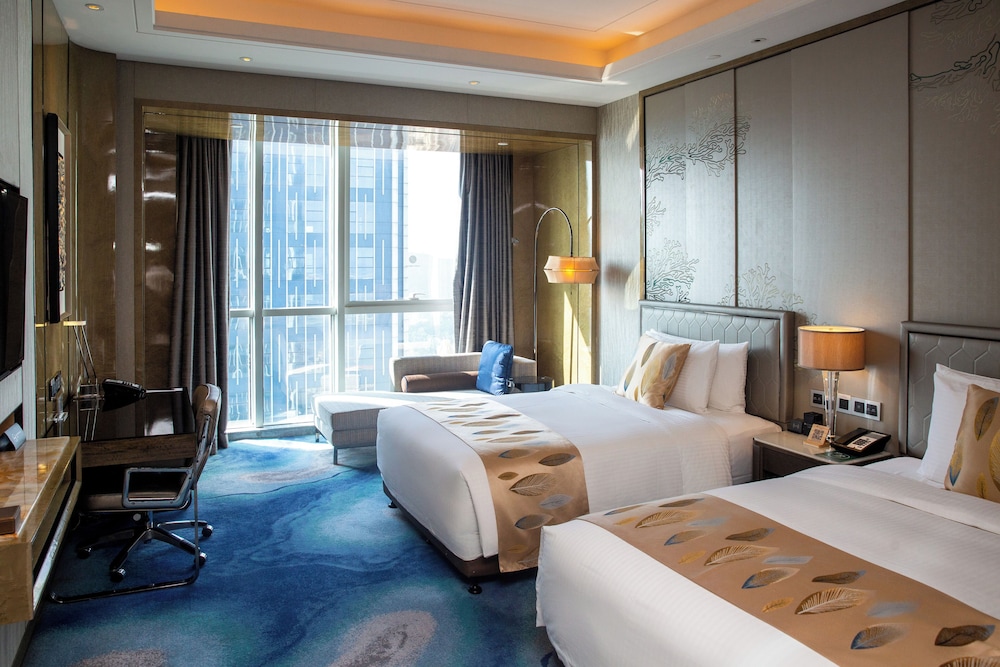 HABITACIÓN EJECUTIVA, Acceso al Salón, Dos Camas Individuales, Piso Alto, Vistas a la Ciudad del hotel Pullman Yantai Center. Foto 5