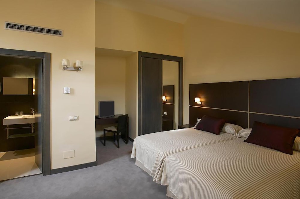 Habitación con 2 camas individuales del hotel Rice Palacio De Los Blasones