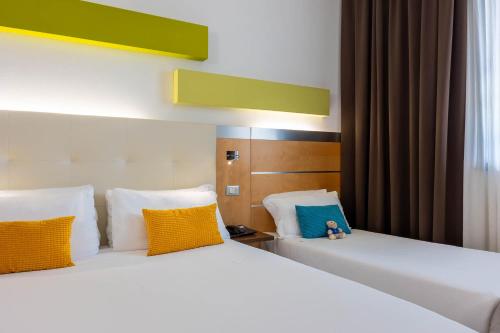 Habitación Triple del hotel IH HOTELS MILANO GIOIA. Foto 3