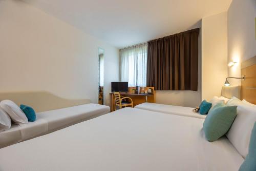 Habitación cuádruple del hotel IH HOTELS MILANO GIOIA. Foto 4