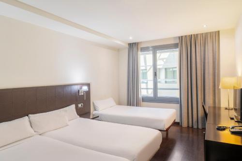 Habitación Doble con cama supletoria del hotel Iberik Santo Domingo Plaza. Foto 1
