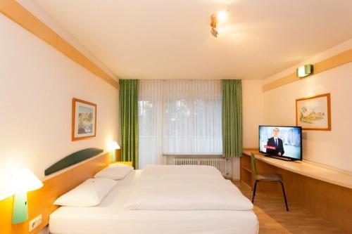 Habitación Cuádruple Estándar del hotel Friends Saarbrücken. Foto 2