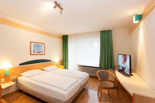 Habitación Cuádruple Estándar del hotel Friends Saarbrücken. Foto 3
