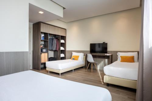 Habitación Cuádruple Deluxe del hotel Ih Hotels Milano St. John Sesto San Giovanni