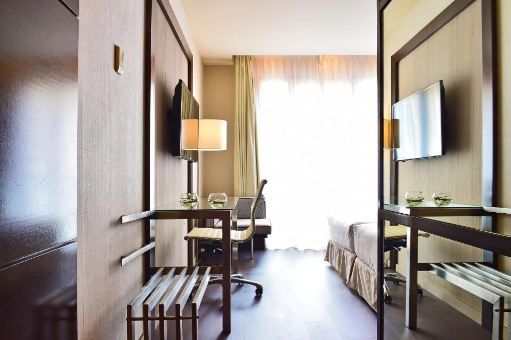 Habitación doble Comunicada del hotel Pestana Arena Barcelona. Foto 3