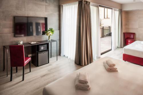 Habitación Familiar con balcón del hotel Spice Milano. Foto 6