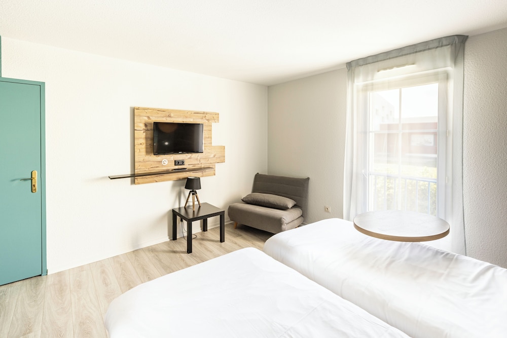 Habitación Standard con dos camas individuales del hotel Ibis Styles Marennes D'oléron. Foto 2