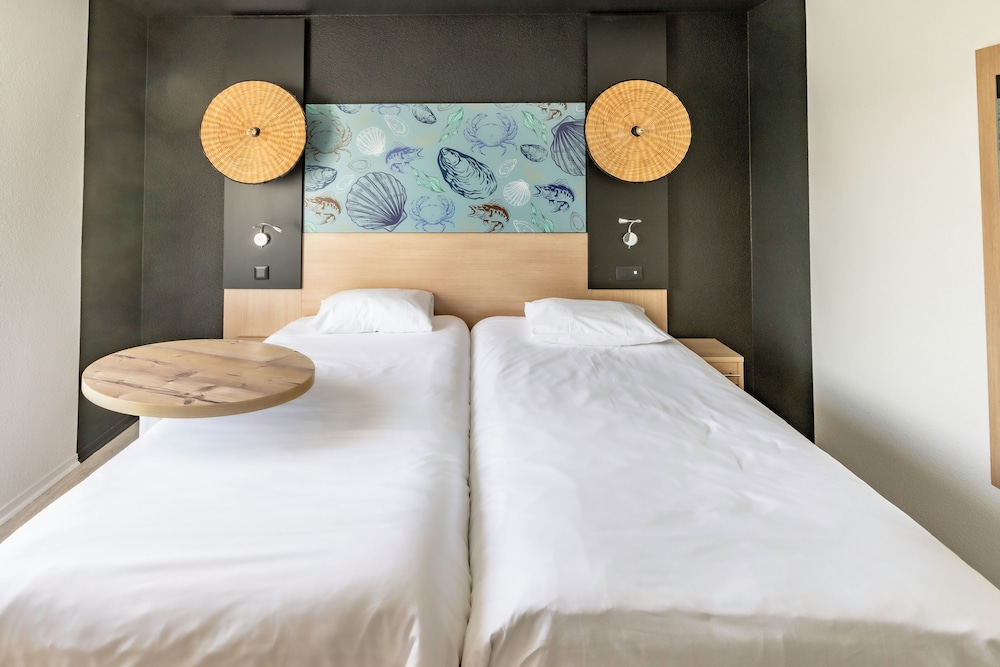 Habitación Standard con dos camas individuales del hotel Ibis Styles Marennes D'oléron. Foto 3