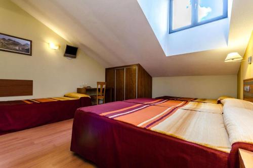 Habitación cuádruple del hotel Ele Mirador de Santa Ana